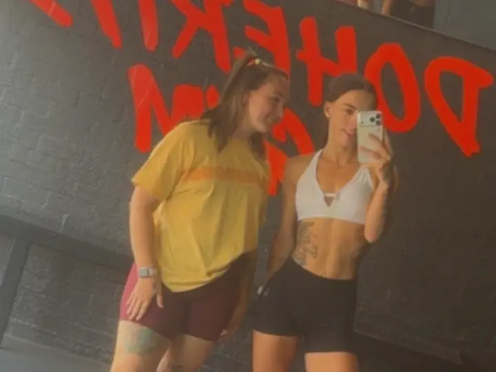 Georgia and Sam in the mirror at Doherty’s Gym in Perth.